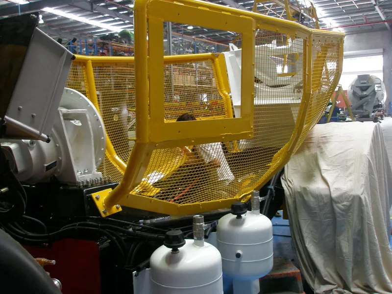 Yellow mesh barrel guarding being fitted to the mining mixer in the Cesco factory