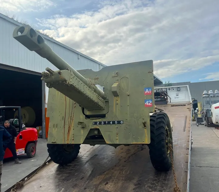A field gun arriving at Hallam for restoration, in faded original paint