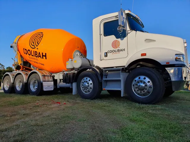 Orange Coolibah Concrete mixer bowl on a white truck