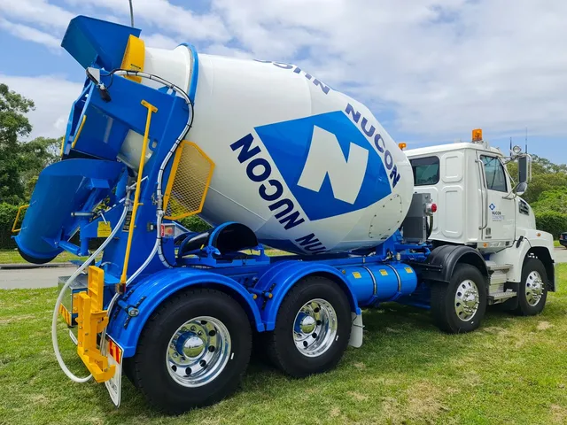 Blue and white Nucon-branded Cesco mixer truck