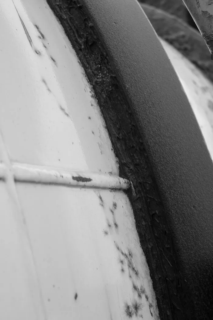 Worn track ring and weld on a concrete mixer barrel, with build-up along the ring