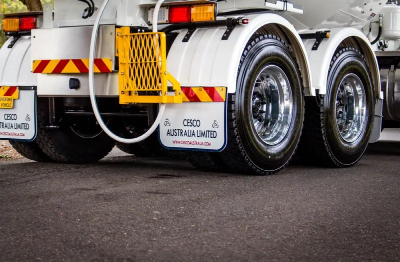Detail of Cesco-branded mudflaps on a transit mixer