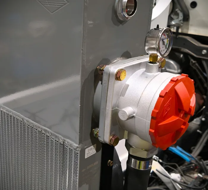 Hydraulic oil cooler mounted on a Cesco mixer frame