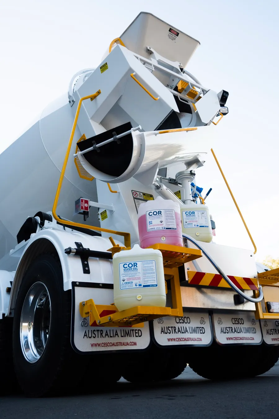 COR containers on the rear step of a Cesco mixer