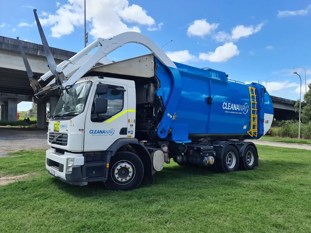 A refurbished Volvo waste collection truck with a freshly painted blue body, after refurbishment at Cesco